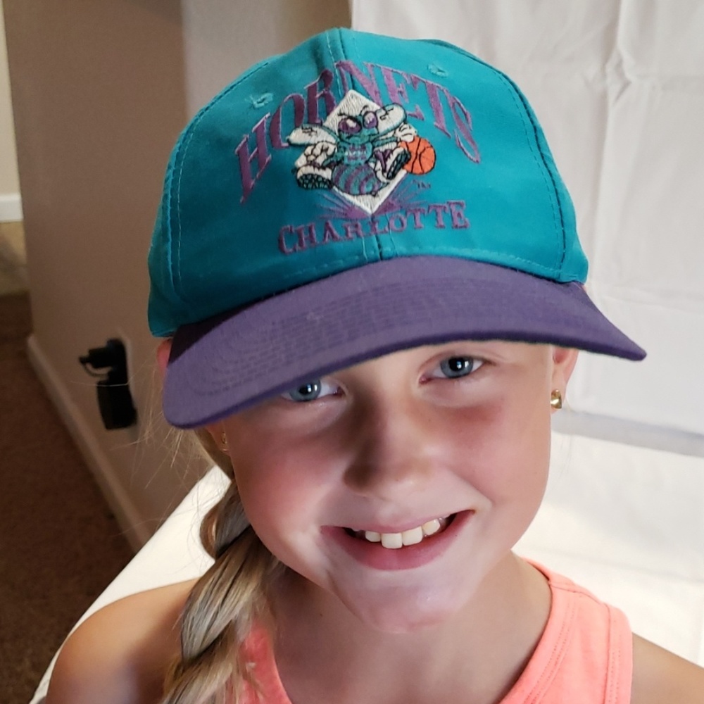 Charlotte Hornets snapback hat.